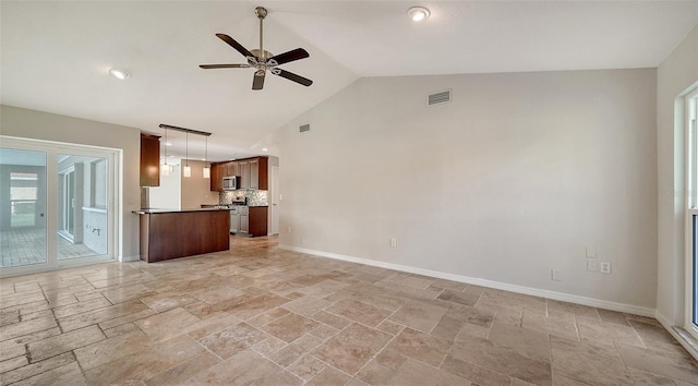 unfurnished living room with ceiling fan and high vaulted ceiling