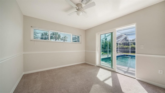 unfurnished room featuring carpet and ceiling fan