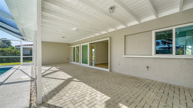 view of patio with a pool and a lanai