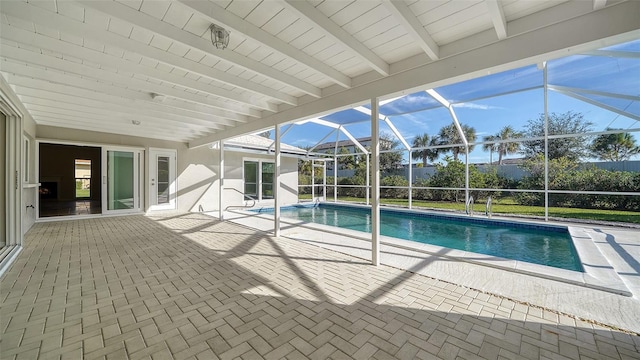 view of pool featuring a lanai and a patio