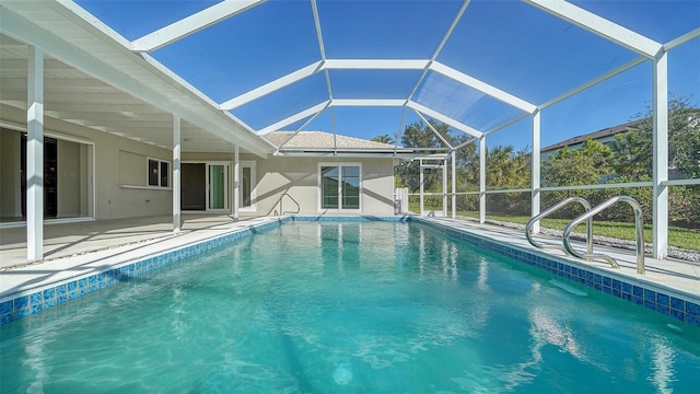 view of pool featuring a patio and a lanai