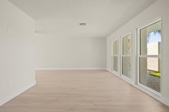 482 Rubens Dr E, Nokomis, FL 34275 - unfurnished room featuring light wood-type flooring and baseboards