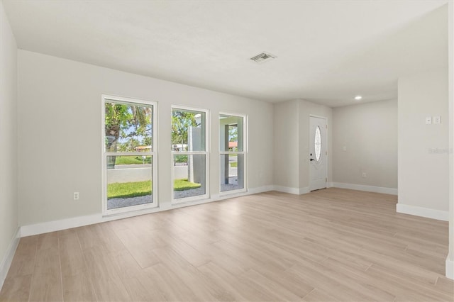 482 Rubens Dr E, Nokomis, FL 34275 - unfurnished room featuring plenty of natural light and light wood finished floors