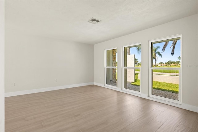 482 Rubens Dr E, Nokomis, FL 34275 - unfurnished room with light wood-type flooring and baseboards