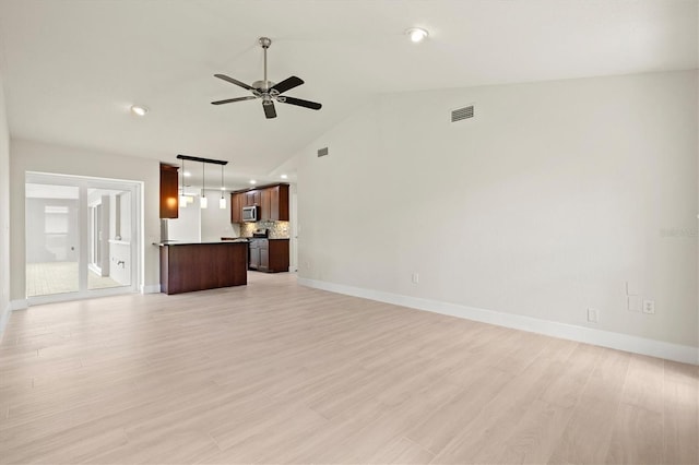 482 Rubens Dr E, Nokomis, FL 34275 - unfurnished living room featuring a ceiling fan, light wood-type flooring, recessed lighting, and high vaulted ceiling