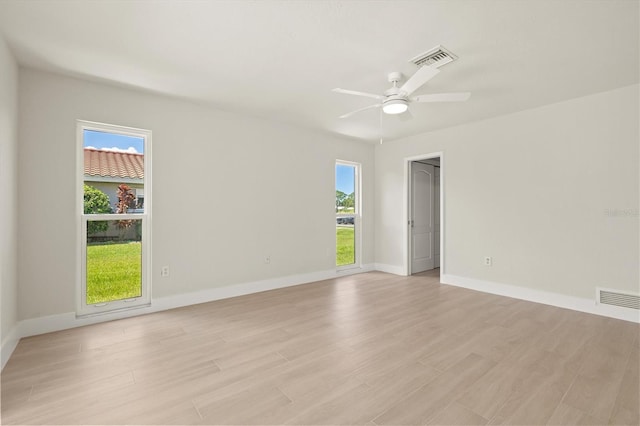 482 Rubens Dr E, Nokomis, FL 34275 - unfurnished room with plenty of natural light, light wood-type flooring, and ceiling fan