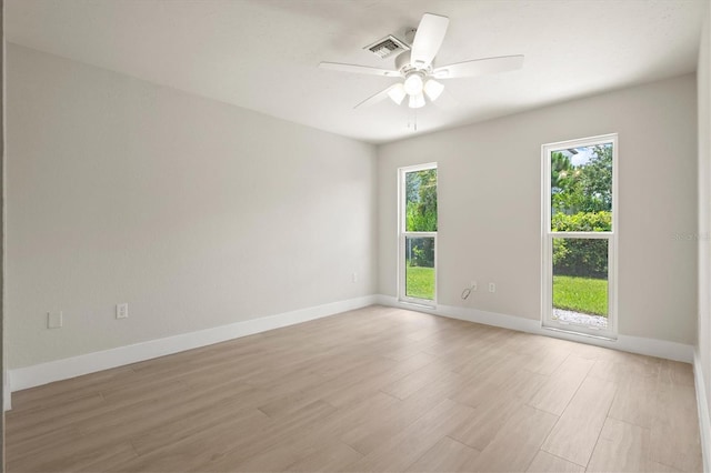 482 Rubens Dr E, Nokomis, FL 34275 - spare room featuring plenty of natural light, light wood-style flooring, and a ceiling fan