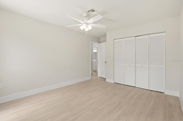 482 Rubens Dr E, Nokomis, FL 34275 - unfurnished bedroom featuring light wood-style floors, a closet, and a ceiling fan