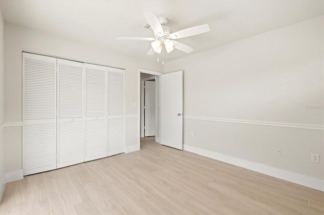 482 Rubens Dr E, Nokomis, FL 34275 - unfurnished bedroom featuring a closet, light wood finished floors, and ceiling fan