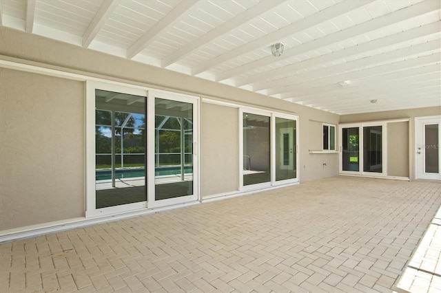 482 Rubens Dr E, Nokomis, FL 34275 - unfurnished sunroom featuring beamed ceiling