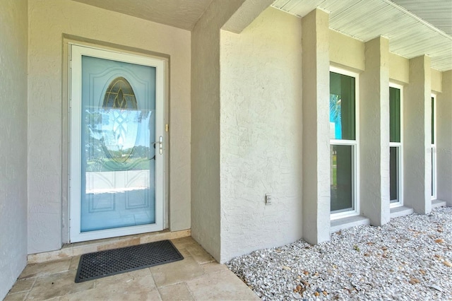 482 Rubens Dr E, Nokomis, FL 34275 - doorway to property with stucco siding