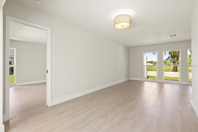482 Rubens Dr E, Nokomis, FL 34275 - unfurnished room featuring a smoke detector and light wood-style flooring