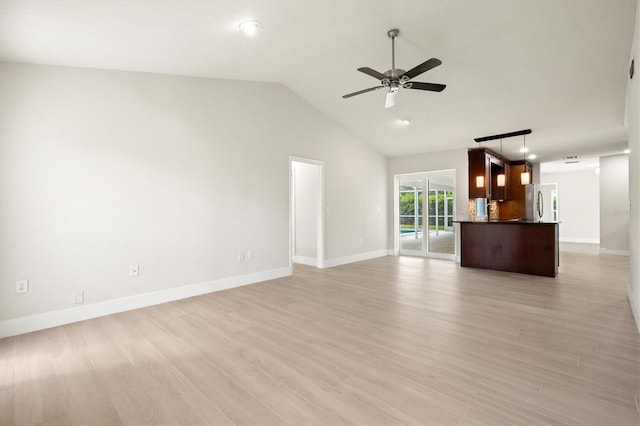 482 Rubens Dr E, Nokomis, FL 34275 - unfurnished living room featuring a ceiling fan, light wood-style flooring, and vaulted ceiling