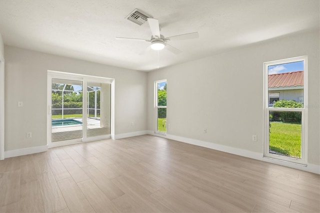 482 Rubens Dr E, Nokomis, FL 34275 - spare room with a ceiling fan and light wood-type flooring