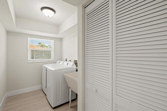 482 Rubens Dr E, Nokomis, FL 34275 - laundry area featuring washing machine and dryer and light wood-type flooring