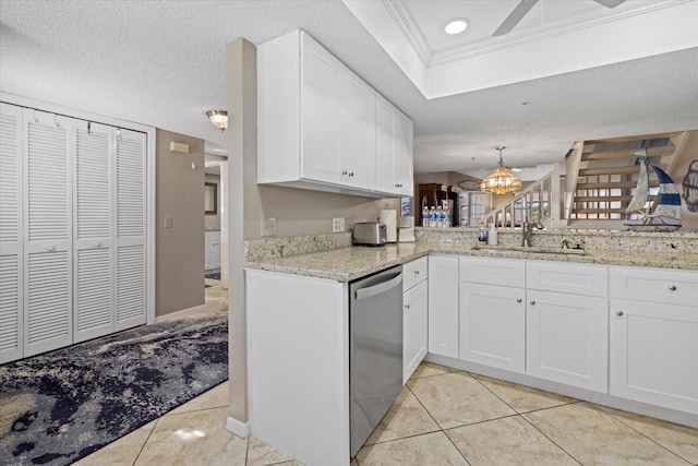 kitchen with stainless steel dishwasher, crown molding, ceiling fan with notable chandelier, white cabinets, and sink