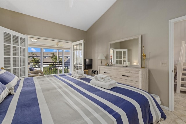 tiled bedroom featuring ceiling fan, vaulted ceiling, and access to exterior