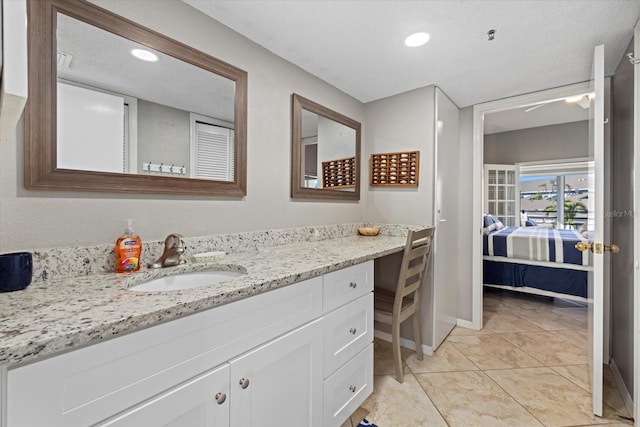 bathroom with vanity and tile patterned flooring