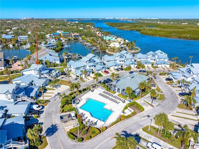 birds eye view of property with a water view