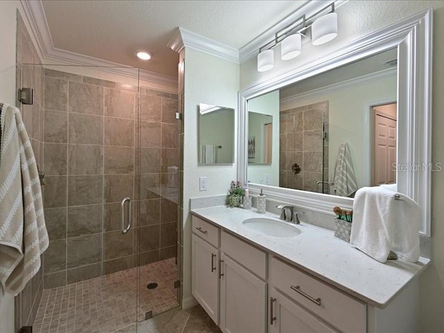 bathroom featuring tile patterned floors, crown molding, vanity, and walk in shower