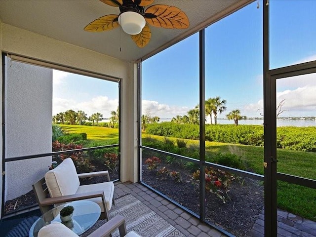 sunroom / solarium with ceiling fan