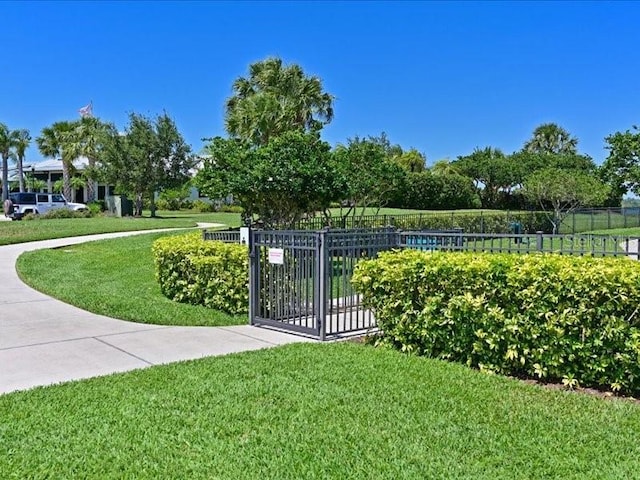 view of property's community with a lawn