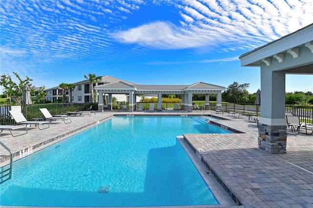 view of pool featuring a patio