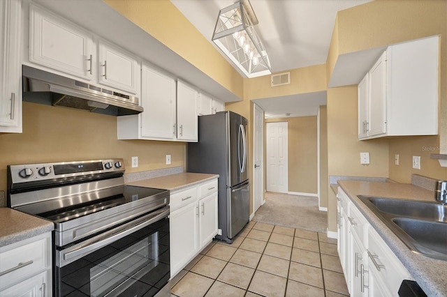 kitchen with white cabinetry, sink, and stainless steel appliances