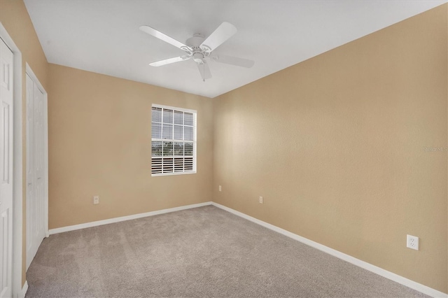 unfurnished bedroom with carpet flooring and ceiling fan