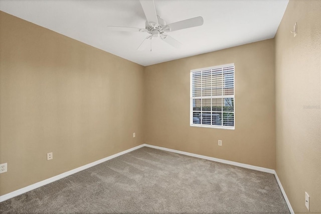 empty room featuring ceiling fan and carpet floors