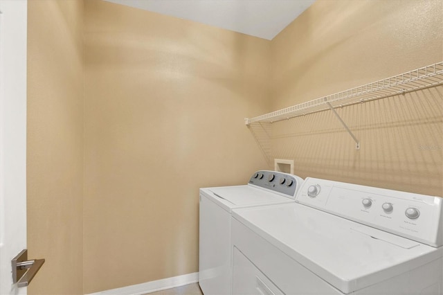 laundry area with separate washer and dryer