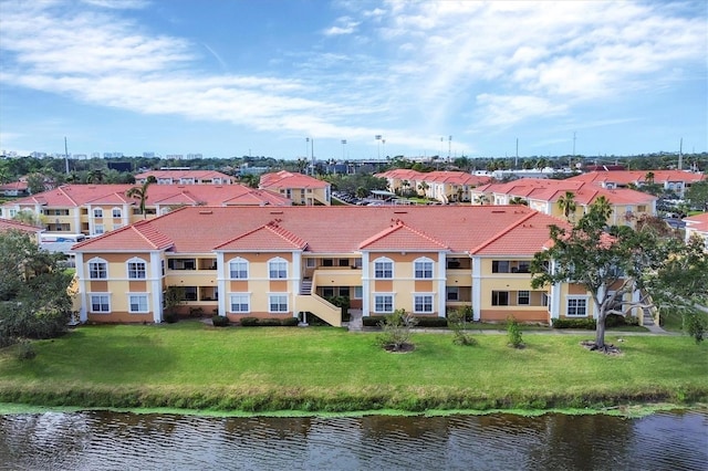 birds eye view of property featuring a water view