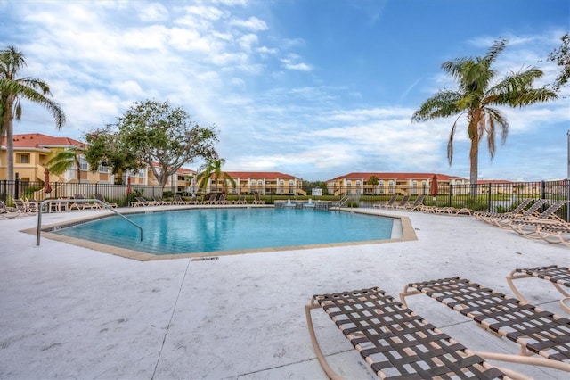 view of swimming pool featuring a patio area