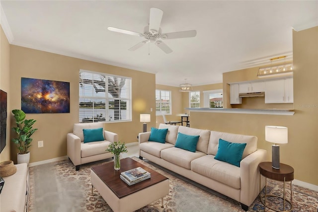 carpeted living room with ceiling fan