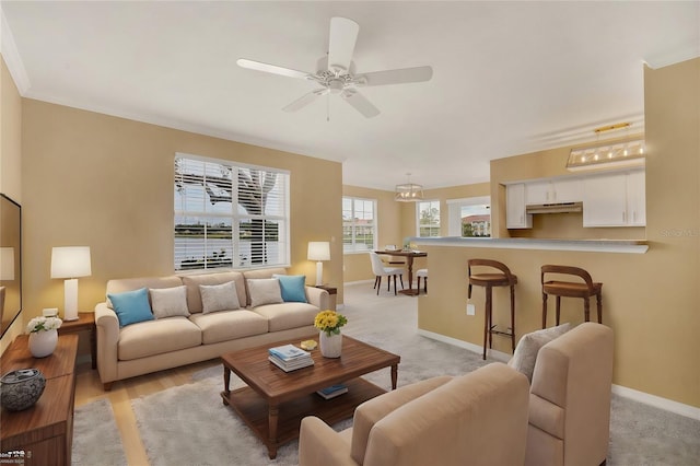 living room featuring ceiling fan and light hardwood / wood-style flooring