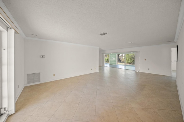 unfurnished room featuring ornamental molding, a textured ceiling, and light tile patterned floors