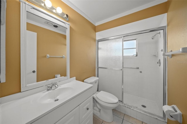 bathroom with toilet, a shower with door, tile patterned flooring, and vanity