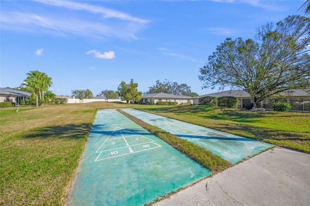 view of home's community with a lawn