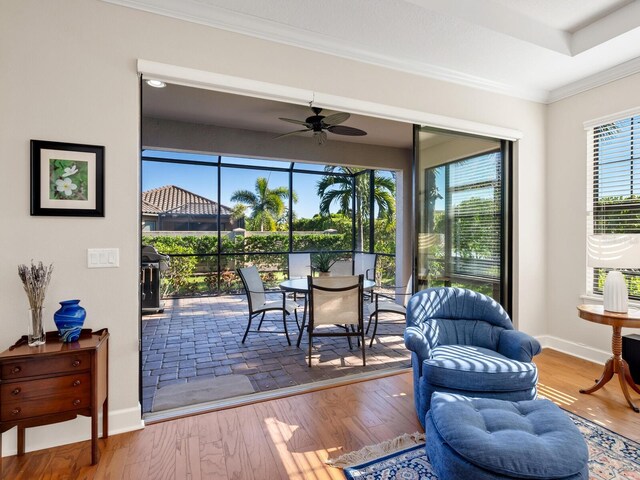 sunroom / solarium with ceiling fan