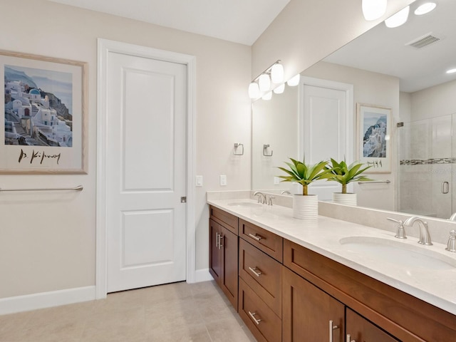 bathroom with tile patterned flooring, vanity, and an enclosed shower