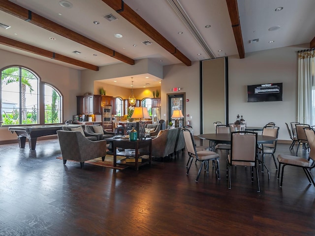 dining room featuring a chandelier, beamed ceiling, dark wood-type flooring, and billiards