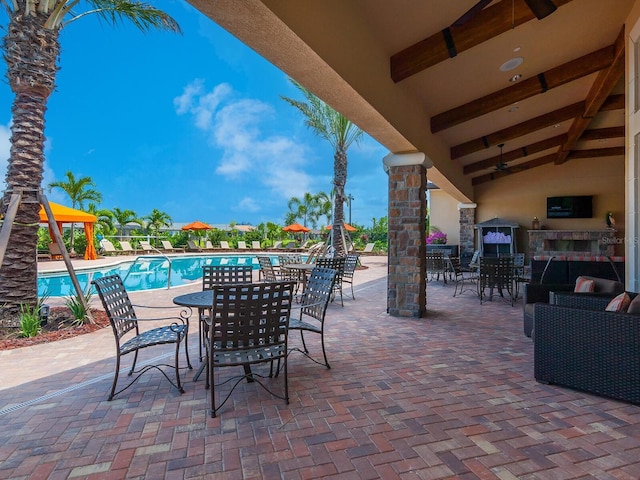 view of patio featuring a community pool