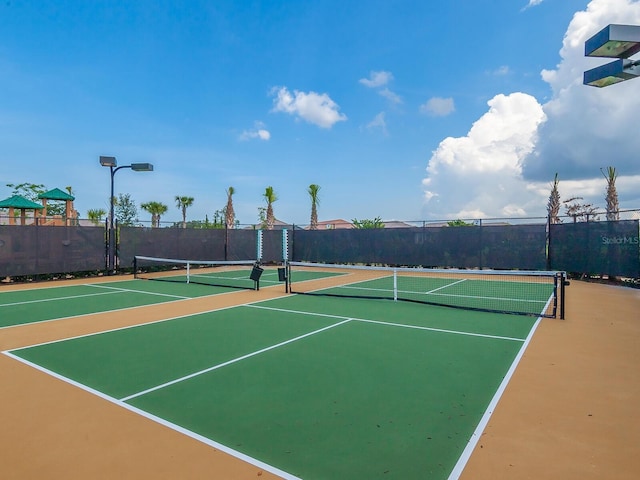 view of sport court with basketball hoop