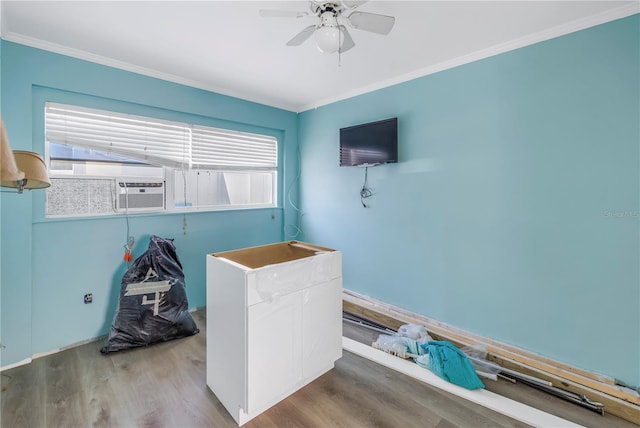 bedroom featuring hardwood / wood-style floors, ceiling fan, and ornamental molding