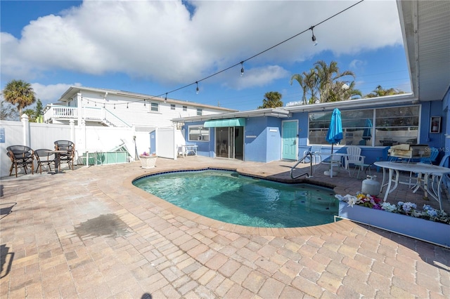 view of swimming pool with a patio area