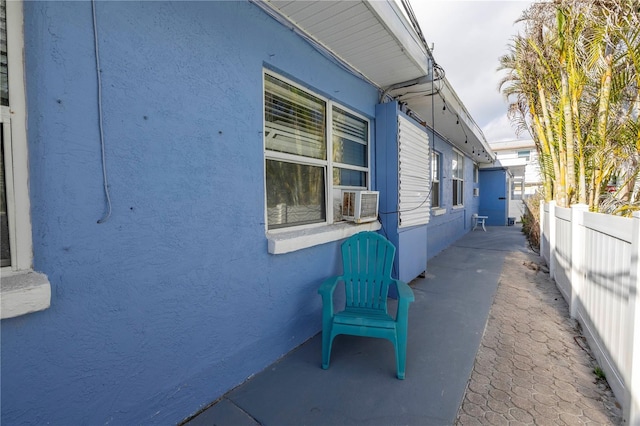 view of side of home featuring cooling unit