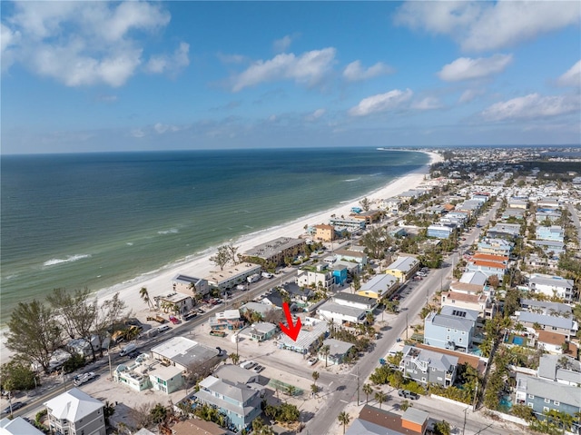 drone / aerial view featuring a water view and a view of the beach