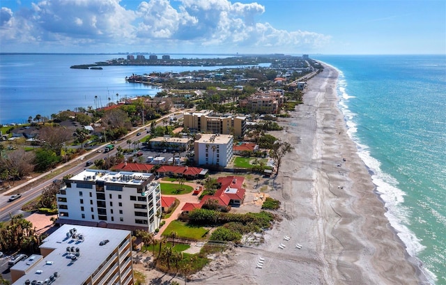 bird's eye view featuring a water view and a view of the beach