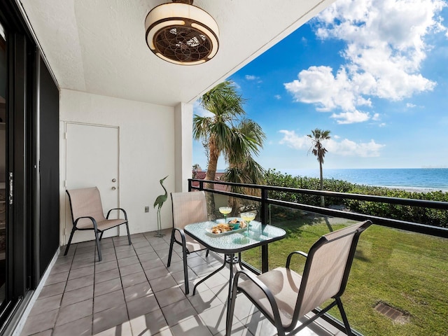 balcony with a view of the beach and a water view