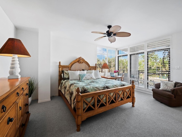 bedroom with ceiling fan, access to exterior, and carpet floors